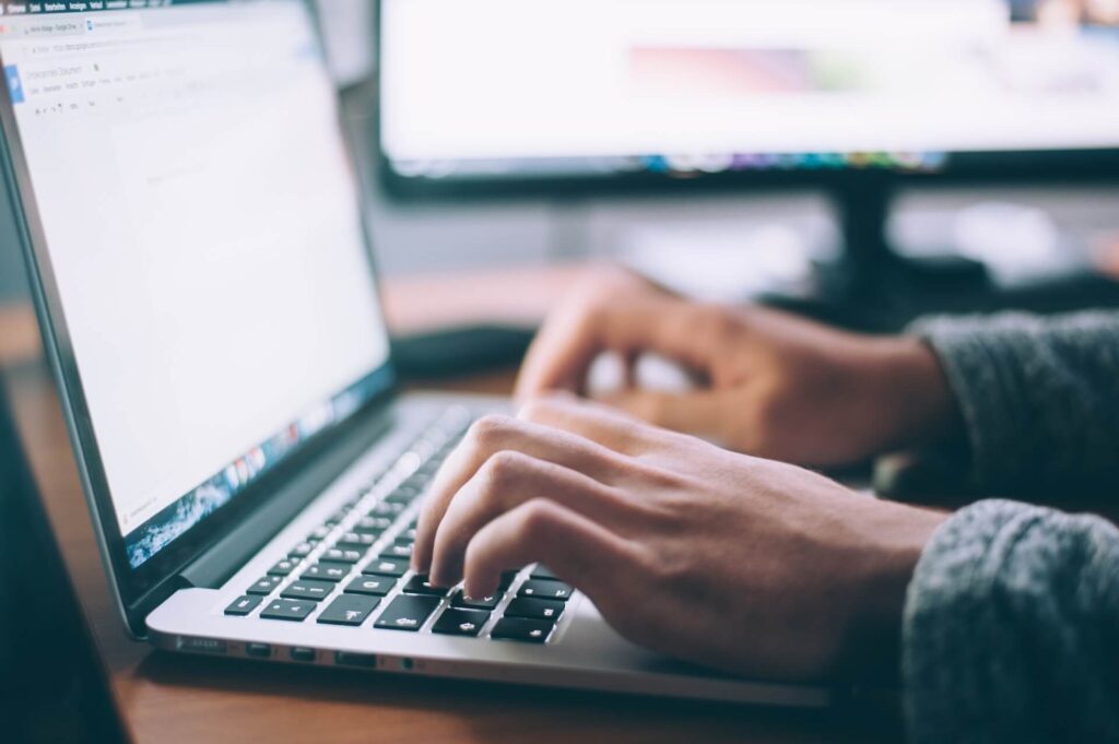 person studying on their laptop